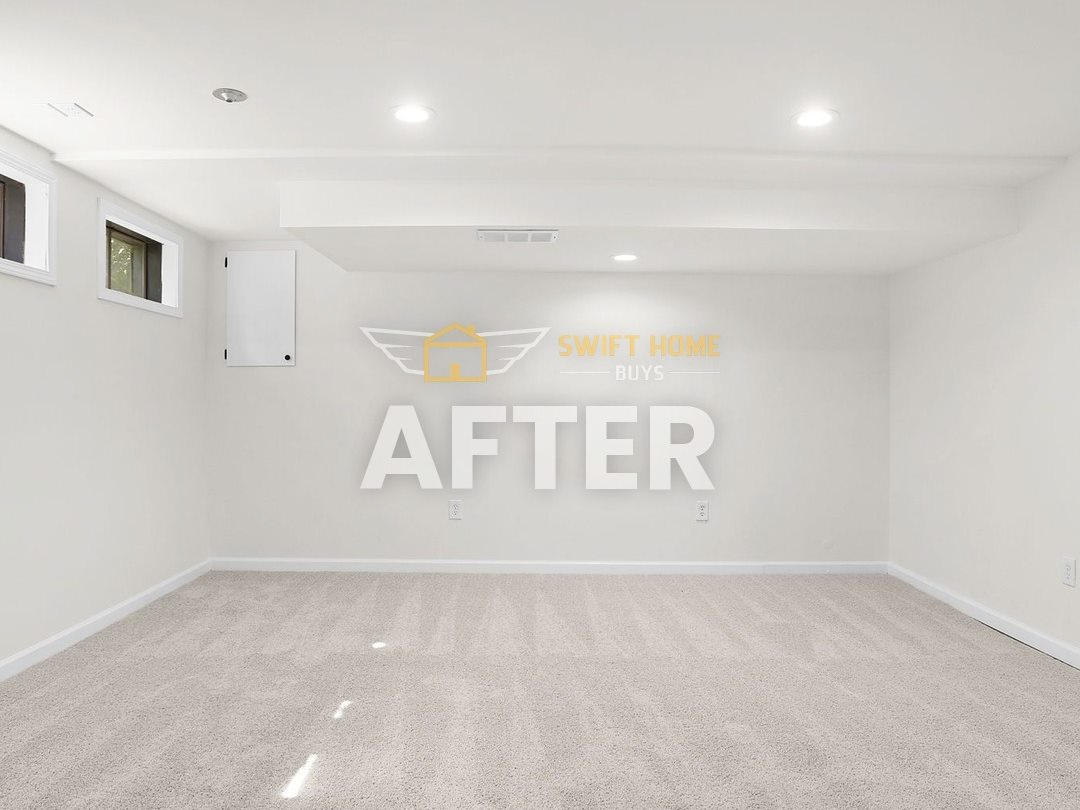 The same Manchester basement after renovation: finished walls, recessed lights and new carpet