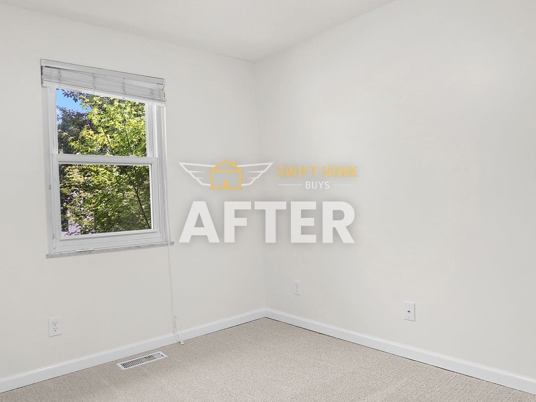 The same Manchester bedroom after: fresh white paint, new carpet and a new ceiling fan