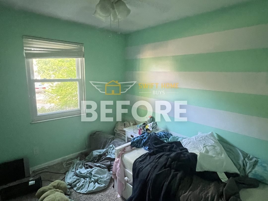 Manchester bedroom before: striped mint-green walls and worn carpet