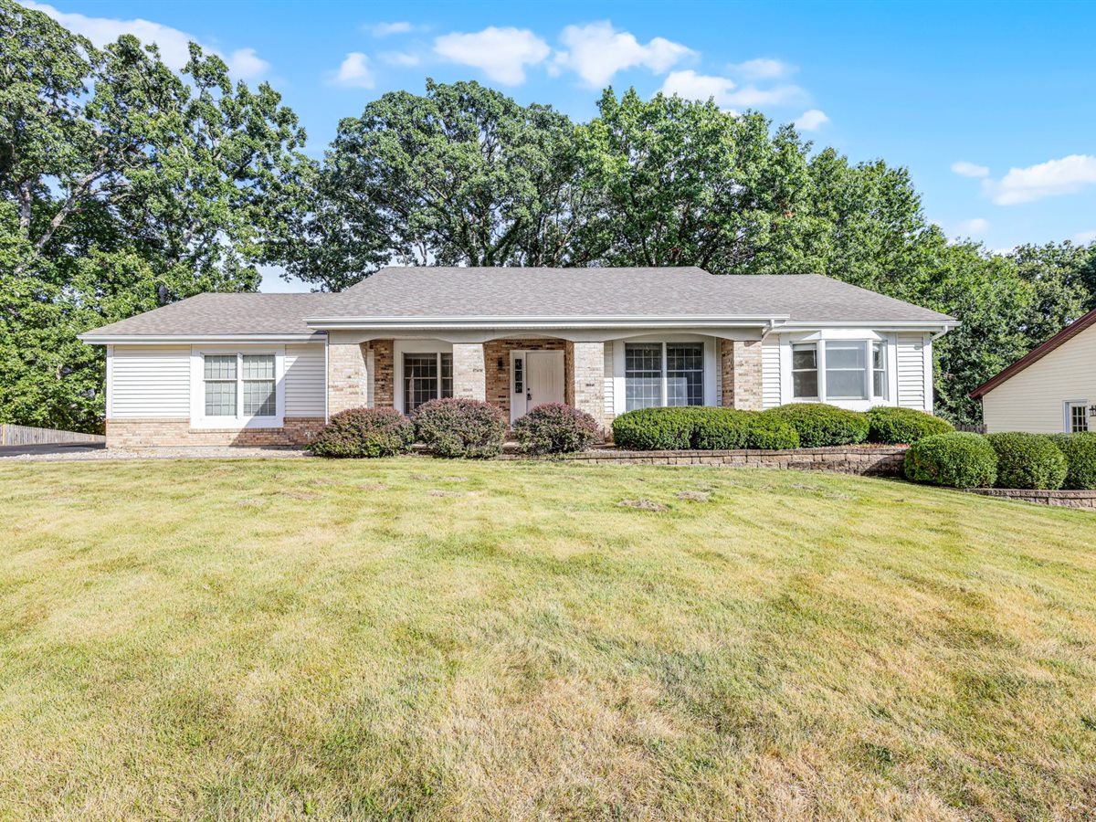 The same Chesterfield ranch after, freshly painted with trimmed landscaping