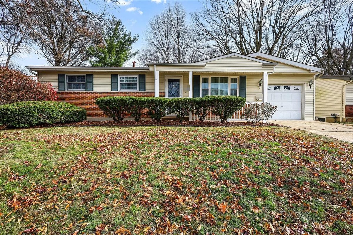Brick and siding ranch with a covered front porch in Florissant, MO, after Swift Home Buys bought it, cleaned it out and made repairs
