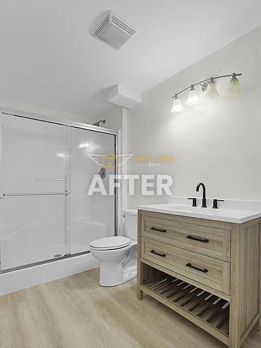St. Charles bathroom after renovation: new vanity, fixtures, lighting and flooring