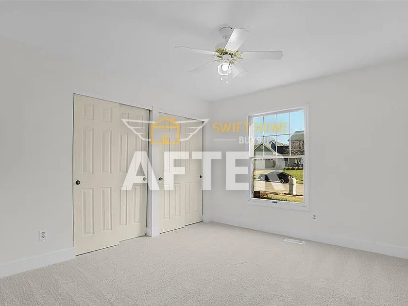 St. Charles bedroom after renovation: fresh paint and new carpet