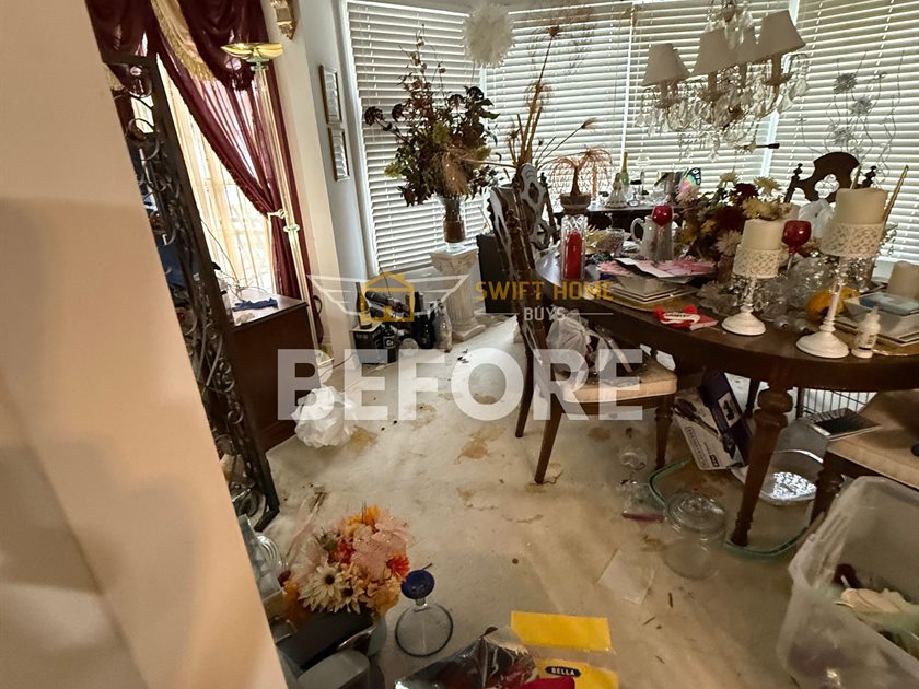 St. Charles dining room before: cluttered table and stained carpet