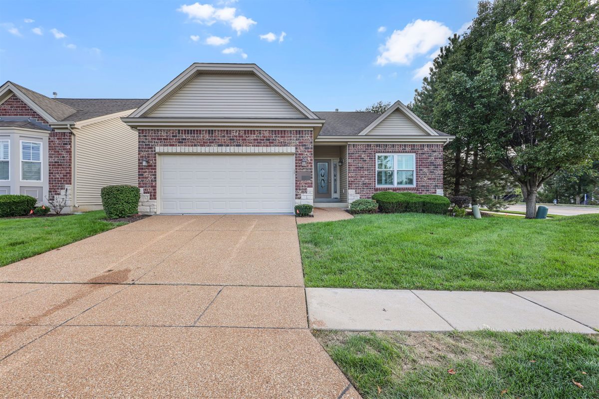 Brick ranch with a two-car garage in St. Peters, MO, after Swift Home Buys bought and updated it
