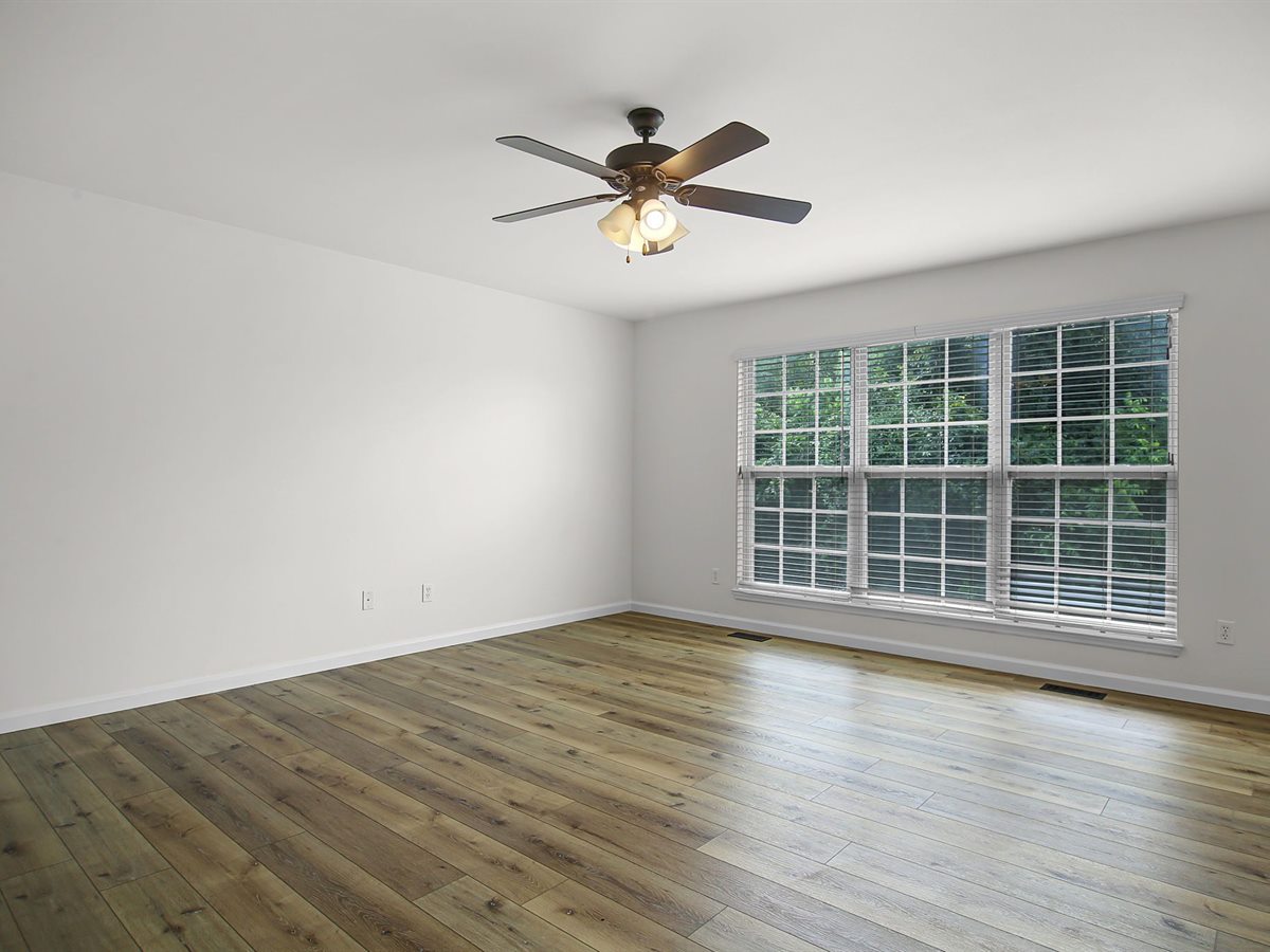 Wentzville house after: new wide-plank flooring in a freshly painted room